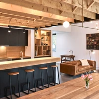 Armcrescent Residence’s contrasting chimney (top), slatted screen and hemlock rafters (middle) and warm feature kitchen (bottom). Photos: Peter Braithwaite (top), Julian Parkinson (middle, bottom)