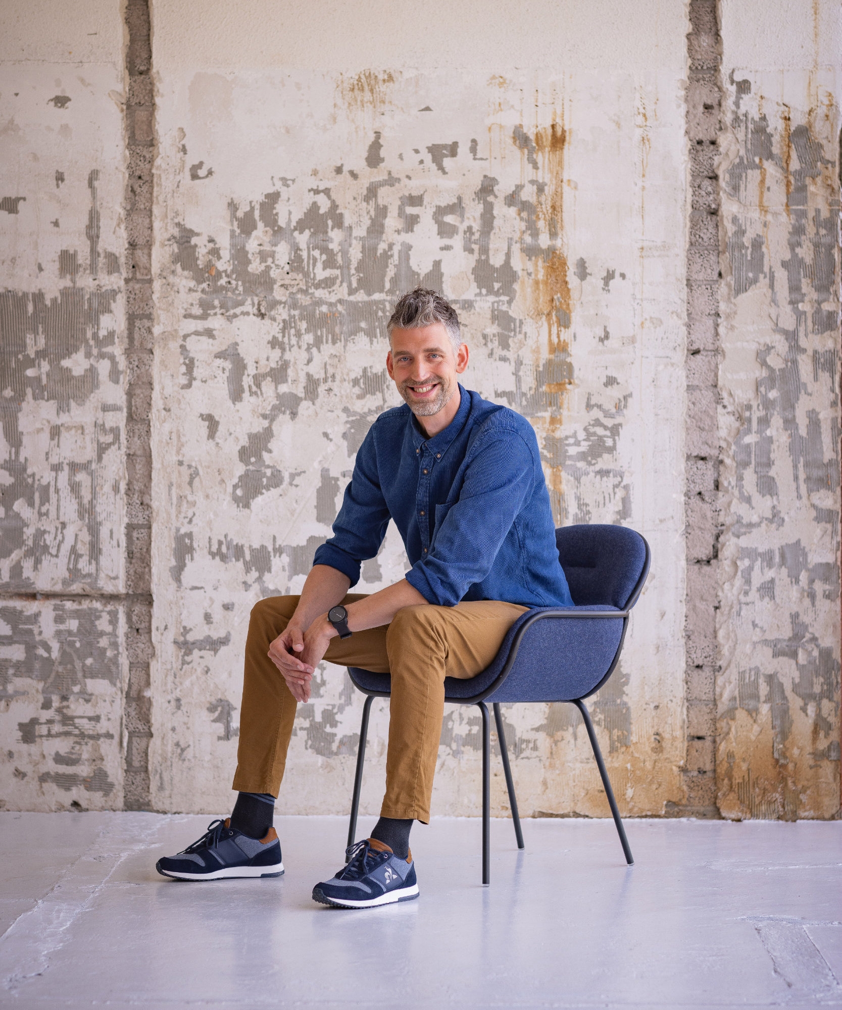 Jan Dijkstra – pictured here with his Fioli chair – describes his design style as ‘friendly, cheerful, sympathetic and always a bit quirky’