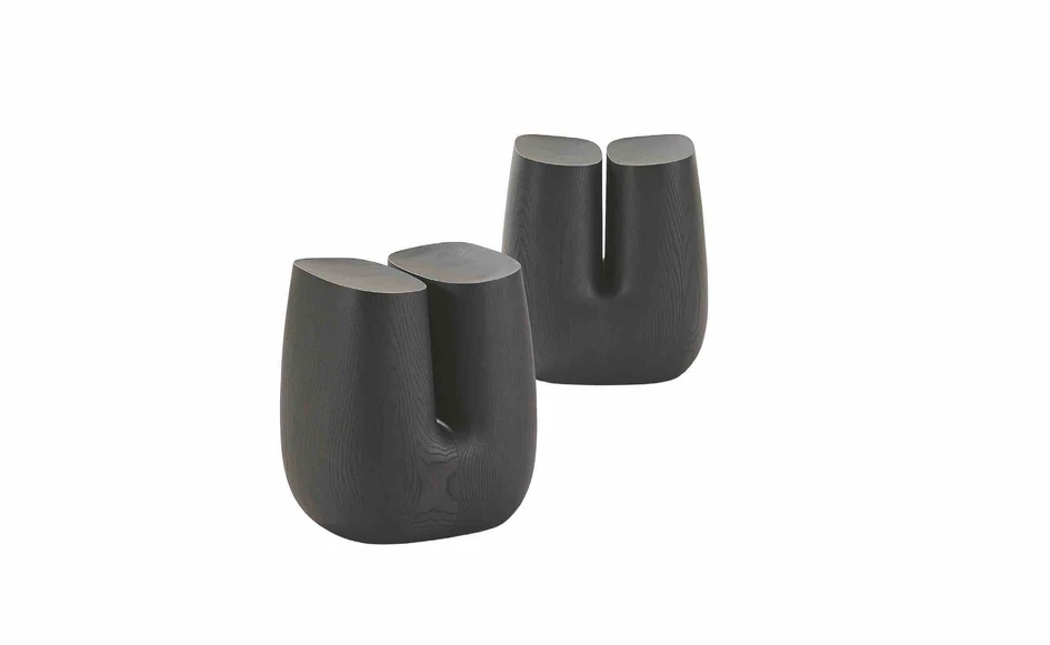 More artistic flourishes are seen in the exquisitely carved black elm stool, Ube, whose shape is inspired by the coco de mer, and the solid Nara bench and console, all designed by Jean Marie Massaud