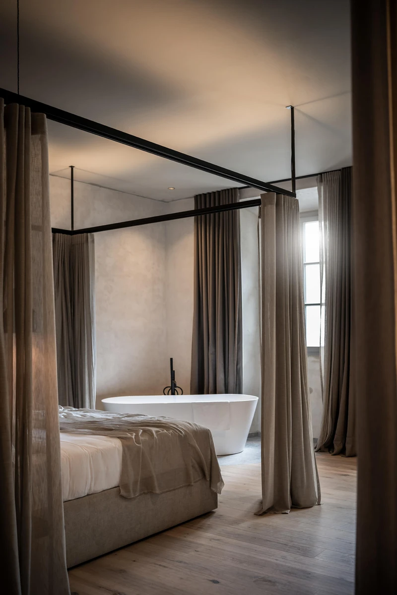 A full-length skylight (top) brings light to the corridor (middle) of this Italian ex-monastery, making the soft tones and acoustic ambience of the room (bottom) the place to be. Photos: Alex Filz