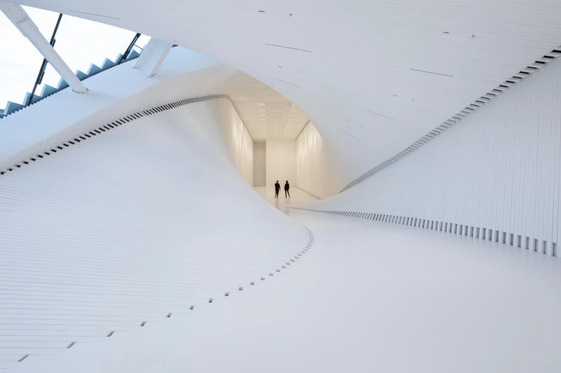 With one half-filled with natural light and the other windowless, The Twist is a bridge, gallery and sculpture twisted into one, with views of the dramatic Norwegian forest. Photos: Laurian Ghinitoiu
