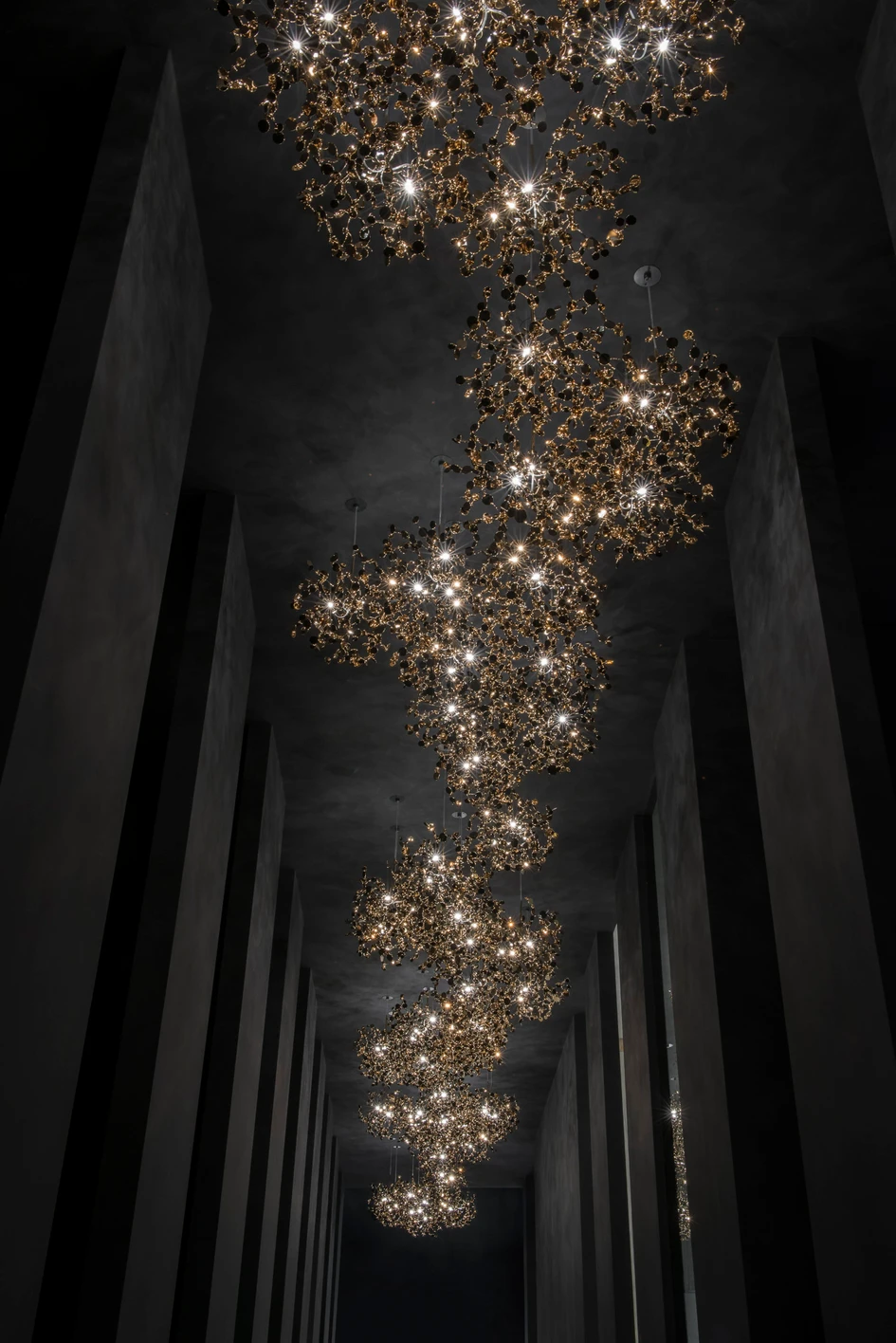 The showroom provides a dramatic setting for presenting bespoke, modular lighting solutions such as the expressive, cloud-like Argent collection