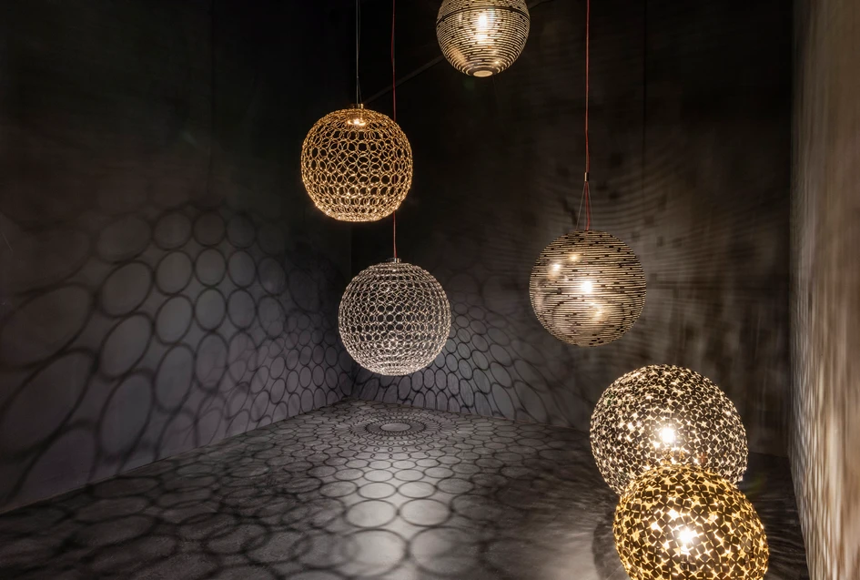 The beauty of illumination is emphasised by the way light is refracted onto walls and floors by designs such as Mizu (top and middle), and G.r.a, Magdalena and Orten'zia (bottom)