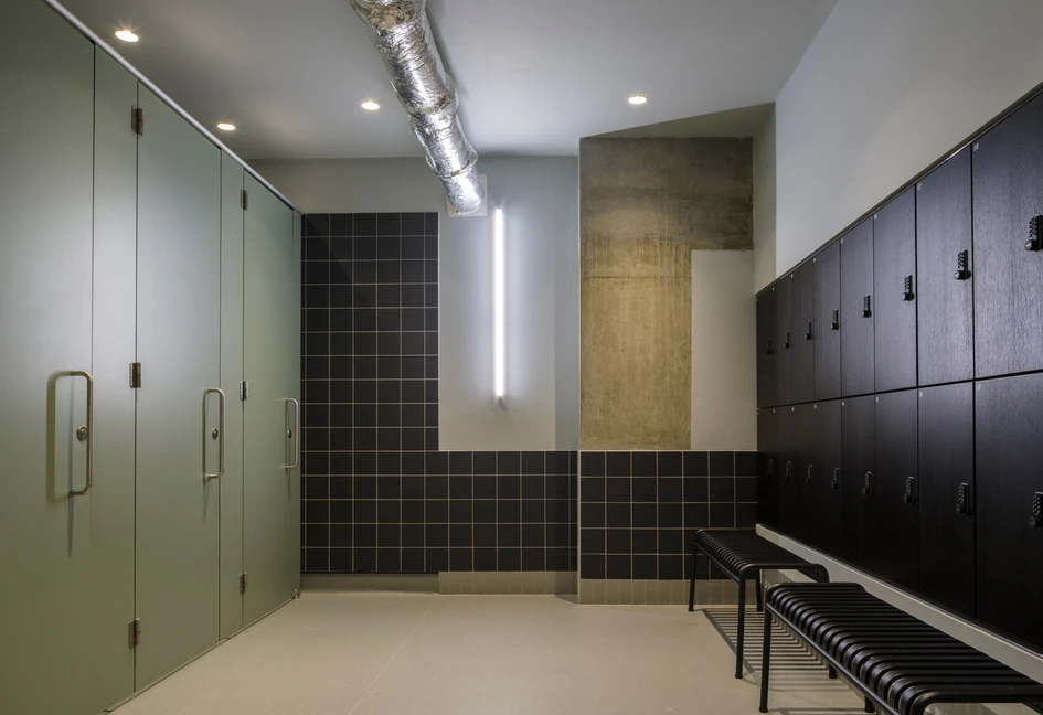 The kitchen area with exercise bike stools at TBWA/HOKUHODO (top) and Thomas House’s in-house boxing gym and showers (middle, bottom). Photos: Hakuhodo Product’s (top), Gareth Gardner (middle, bottom)