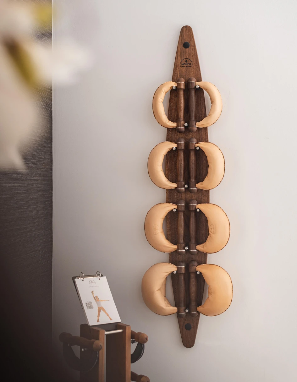 Three ways to lift: Technogym’s Wellness Rack (top) takes up minimal space, Trimm dich dumbbells (middle) take you back to the stone age and the SwingBoard weight storage (bottom) looks like wall art