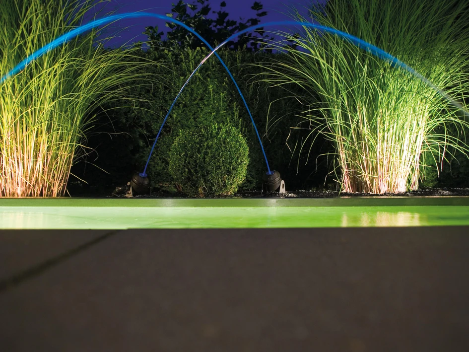 Arcing LED water jets from Oase create dancing performances with enough majesty for large public installations (top), and stylish private settings (bottom)