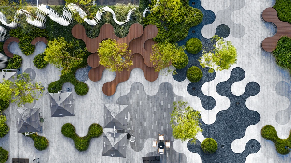 The Hyperlane Urban Gallery creates a circular-themed promenade with connected paving, shallow water, shaded seating and shrubberies. Photo: Bing Lu