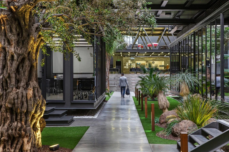The Biophilic Office in Indonesia interacts with nature (top, middle), and Ates Wind Power’s HQ in Turkey re-homes it inside (Bottom). Photos: Mansyur Hasan (top, middle), ZM Yasa (bottom)