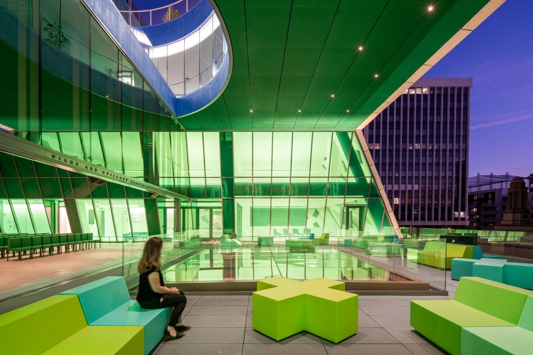 For OMA's  hulking 55,000 sq ft punctured light box (top), the architects used eight layers of green Vanceva® PVB interlayer, combined with metal mesh, throughout the building