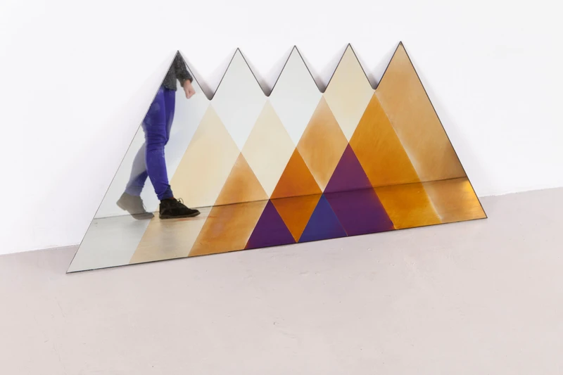 Petite Friture’s colourful Francis mirrors (top), Arketipo’s art deco Vanity Fair rhombus mirrors (middle) and Tuttobene’s modernist triangular Transience mirror (bottom)