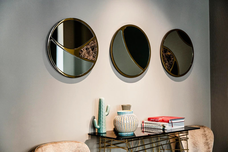Sovet’s Visual collection offers a choice of mirror finishes for a captivating look (top), while Black Tie’s Delta trio add marble and gold interior lining (bottom)