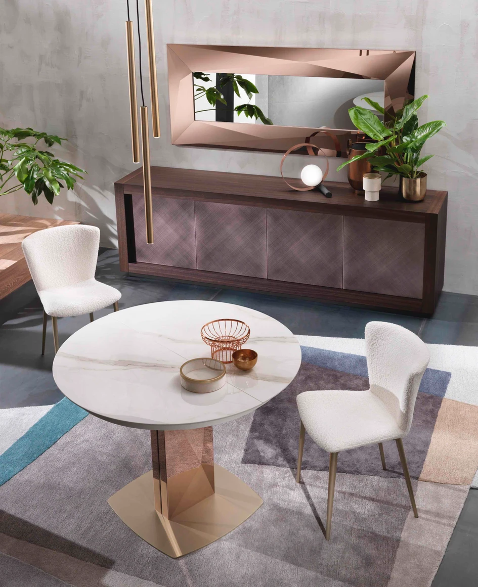 With a circular top, Sabino makes a statement hall table. By contrasting the materials of the base, pedestal and top it has a totemic, sculptural presence