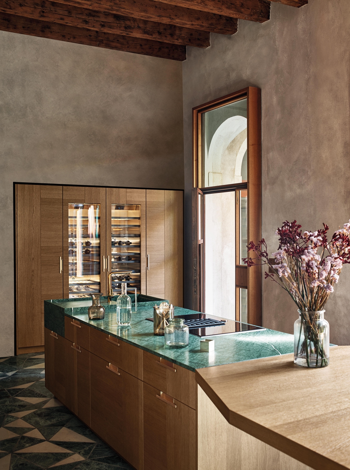 Cesar’s Intarsio Art & Order fitted kitchen demonstrates a succulent green marble surface