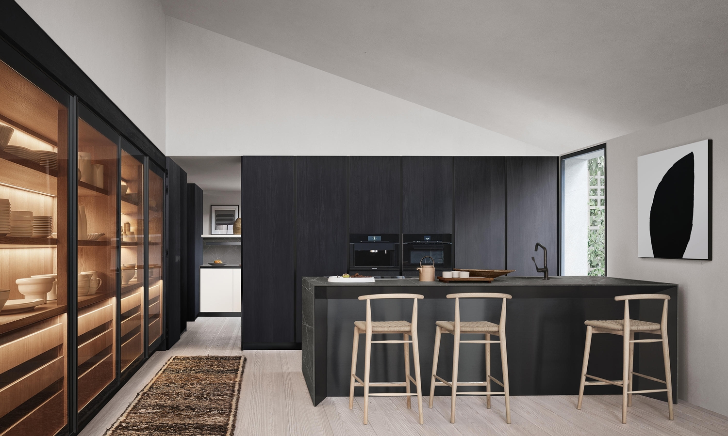 Arcilinea’s Thea fitted kitchen with waterfall worktop island in matte veined quartz