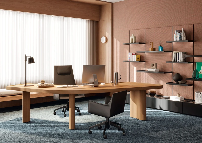 Charlotte Perriand's iconic Bureau Boomerang desk is adapted for Cassina Pro with integrated cable storage