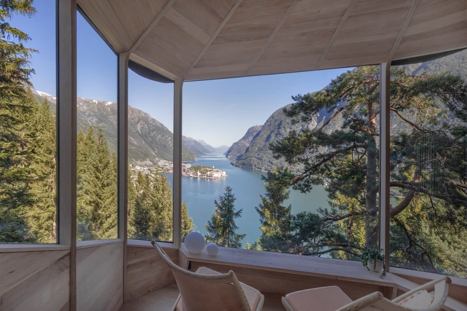 Perched high in the branches (top), the pair of cabins hold on to their pine tree spines for stability (middle). Inside, the view from six-feet up is astounding (bottom). Photos: Snidre Ellingsen