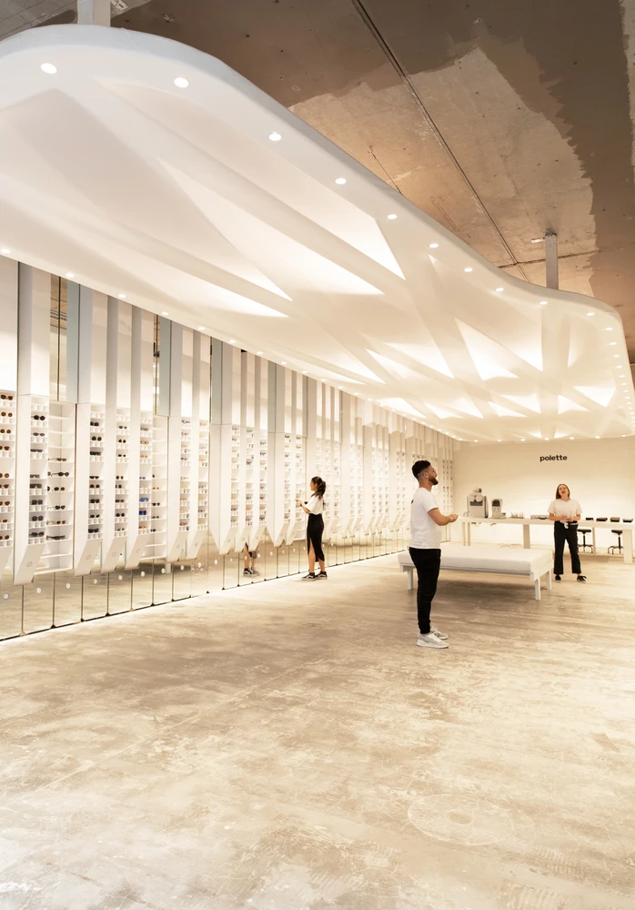 The Polette store’s 88 light-up piano key shelves and mirrors bring buyers together, while an upside-down grand piano ceiling light continues the musical theme: Photo: Polette photography team