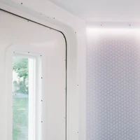 Climb in and take off: In theory at least, you leave planet Earth behind as soon as you pass through the airlock. The honeycomb structure of Design Composite's clear-PEP® panels creates an exciting light-scattering effect
