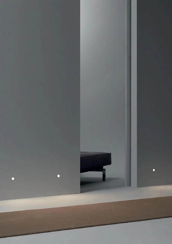 The Coworkrs workspace by Leeser Architecture directs workers with integrated strip lighting (top), while small recessed Mood wall lights from Simon keep hallways and landings safe at night (bottom)