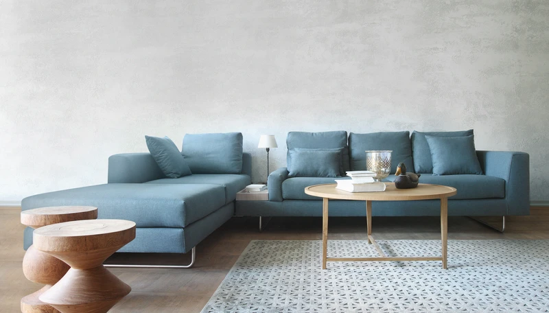 Moya’s Lost sofa system features handy integrated side tables, combined with low armrests for easy reach, and high armrests for comfort