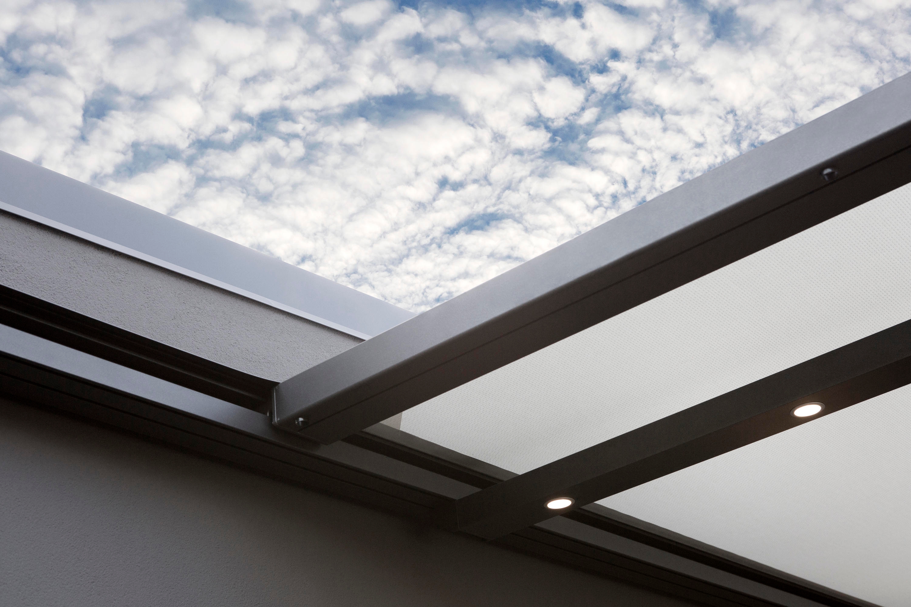 The GENNIUS XTESA awning from KE Outdoor Design keeps outdoor areas dry, while letting in the light