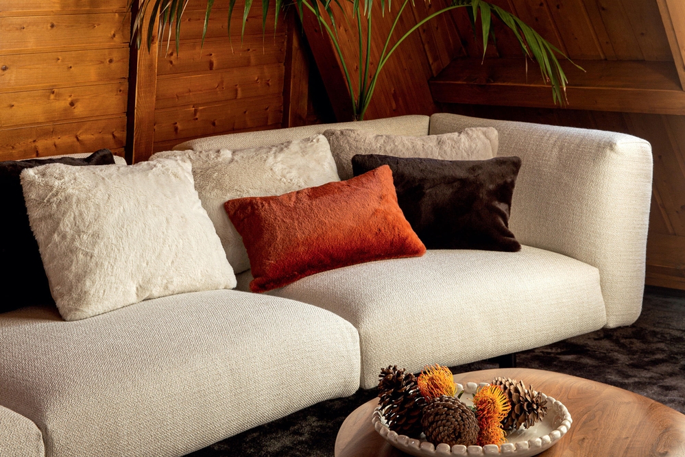 Gloster Furniture’s comfortable Grid outdoor seating system remains in use year round with weatherproof fabric (top, middle), while faux fur Winter cushions from Elitis (bottom) keep seats snug