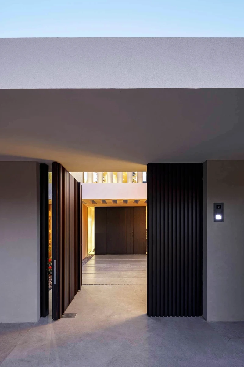 Ceramic exterior flooring provided by Twelve Concept makes a smooth transition into the interior spaces following clean lines and a natural colour palette