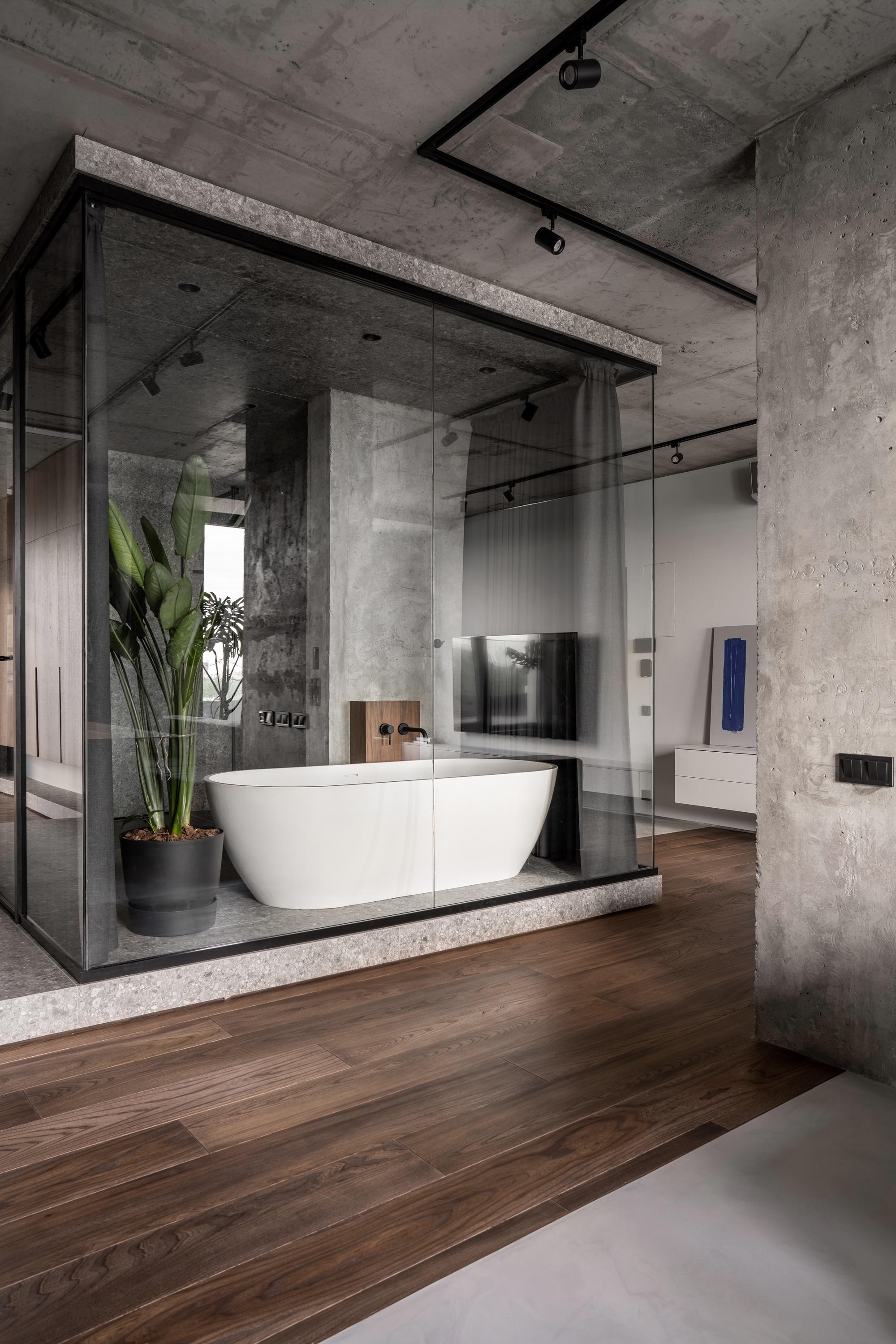 MiQ Offices’s colourful chain-link partition (top), PIXLIP’s own HQ’s light walls (middle) and the centrally-located glass bathroom in the Rybalsky Apartment in Kyiv. Photo: Andrey Bezuglov (bottom)