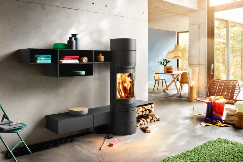 The Optifocus fire from Focus has a raised hearth to stop pets or children getting too close (top), and the various storage sections of Skantherm’s Elements fireplace separates wood (bottom)