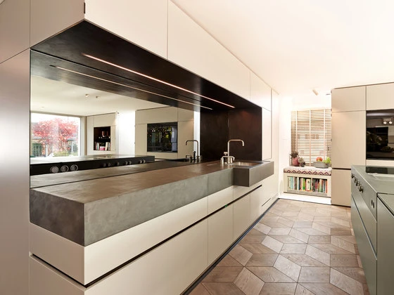 The mirrored splashback at the top-floor Above the Roofs apartment helps users see over the treetops, even when faced away. Photos: Mierswa & Kluska