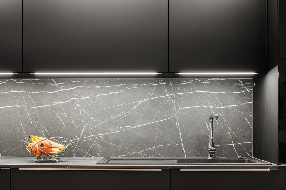 Pink-veined marble planter with integrated electrical points at the Midi du Midi project (top, middle) and Egger’s PerfectSense worktop which continues up the wall (bottom). Photo: Jef Jacobs (top, middle)