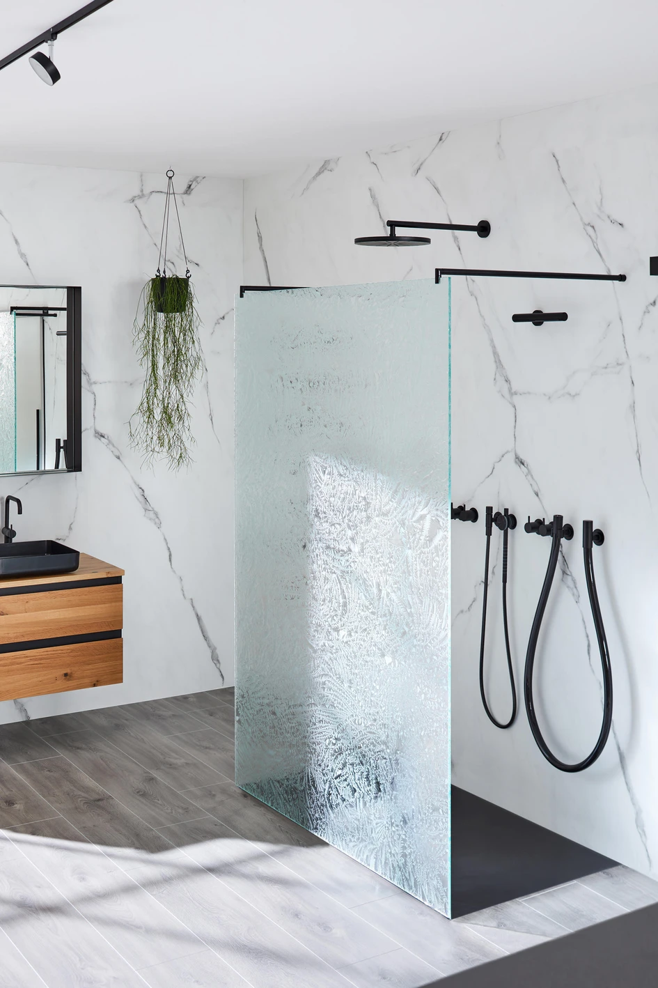 Duscholux’s partially frosted Allegra shower doors (top) and Glas Marte’s ICE-H screen with ice crystal patterning (bottom) keep privacy functional and aesthetic