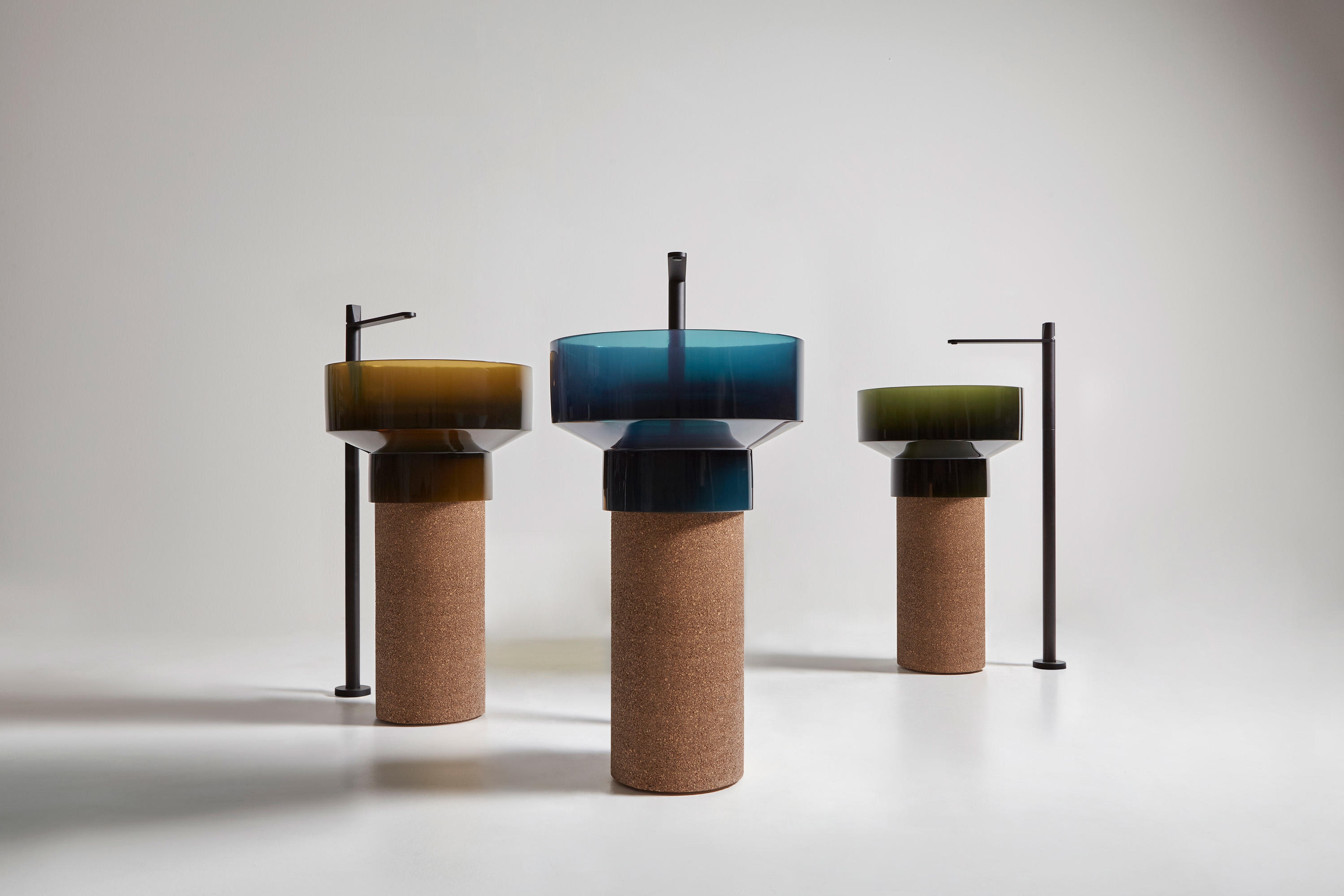 Cork tables at Tom Dixon’s monochromatic Manzoni Restaurant dining hall (top) and antoniolupi’s Borghi sinks with Cristalmood basins set on strong cork pedestals. Photo: Peer Lindgreen (top)