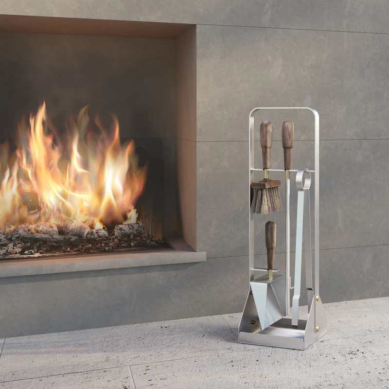 The sleek Lumiére Companion Set, with its stainless steel frame and oiled walnut handles, is perfectly formed to withstand the outdoor elements. The perfect companion to moments around the fire with those you love