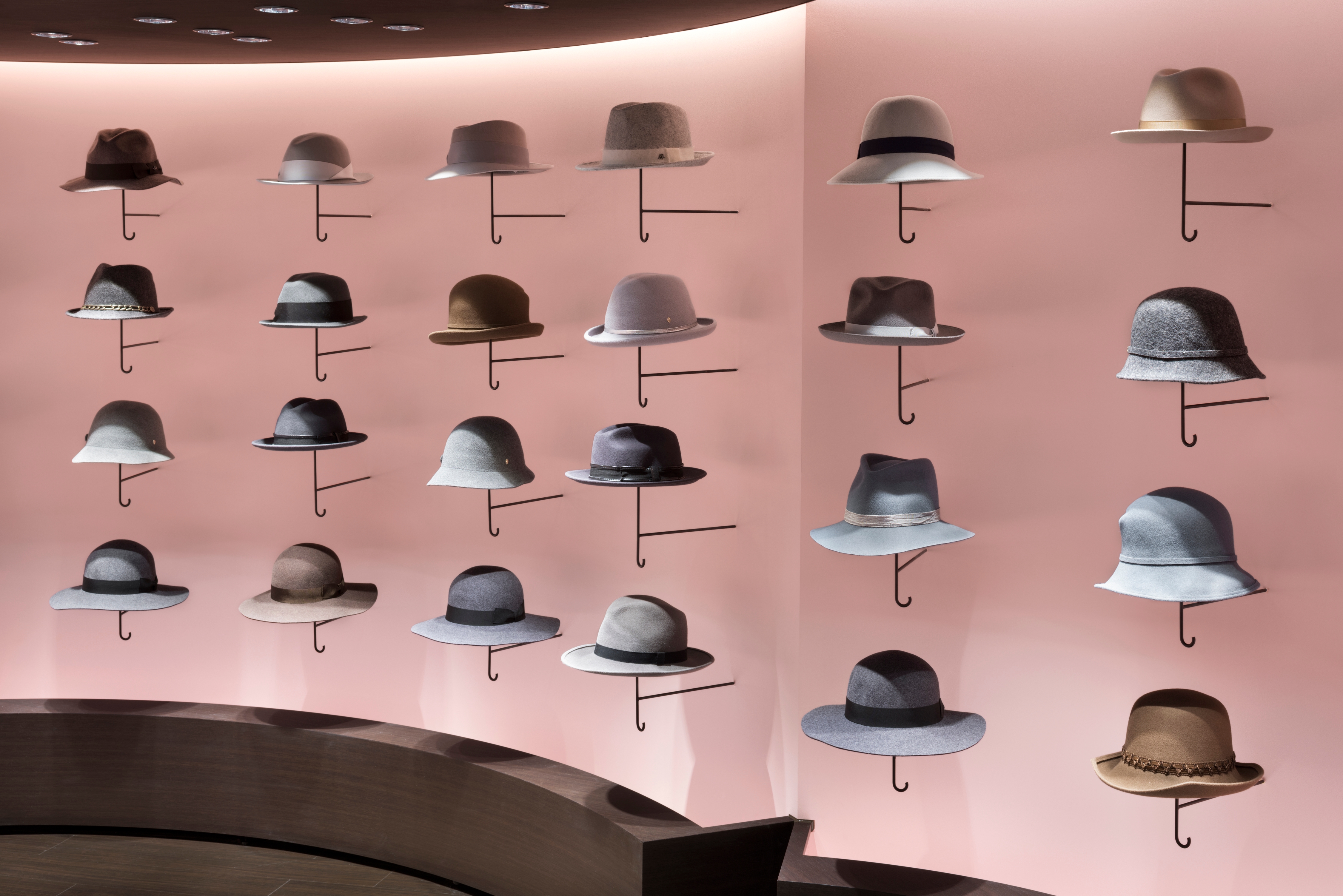 nendo’s Hat Cloud design for a hat store in Tokyo makes playful reference to the relationship between hat and umbrella by curving the base of each hat’s hook. Photo: Takumi Ota