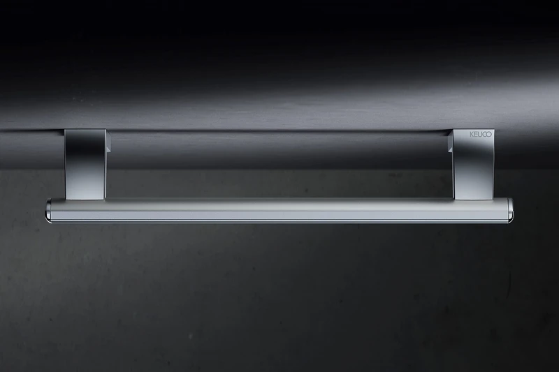 The grab bar and shower spray bar can be installed as one functional and visually elegant unit, and the railing system's discreet wall mounts provide reliable stability for barrier-free design