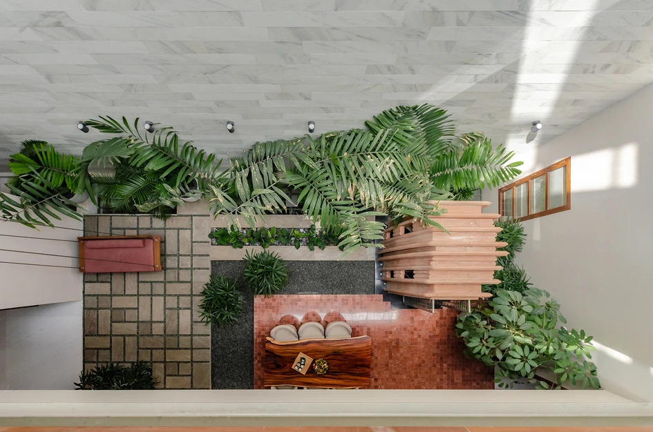 The courtyard of The Breathing House in Surat, India, extends over several floors and is protected from the elements by an oversized skylight. Photos: Pratikruti09