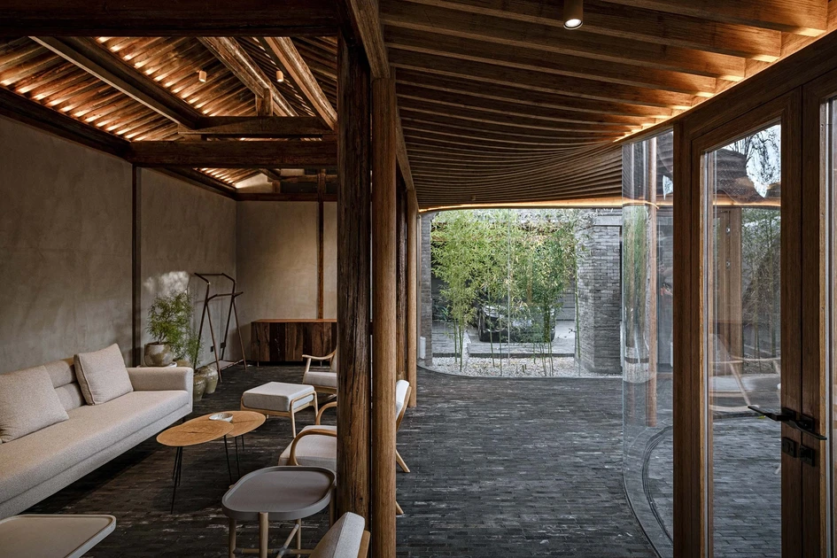 Qishe Courtyard in Beijing, China, uses a glass veranda to connect different areas of the house – and its inhabitants to the outdoors. Photo: Ning Wang