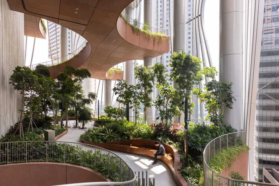 The mixed-use Capita Spring building in Singapore draws back its facade curtains to reveal environmental insides underneath, with tall public-use gardens set at intervals. Photos: Finbarr Fallon