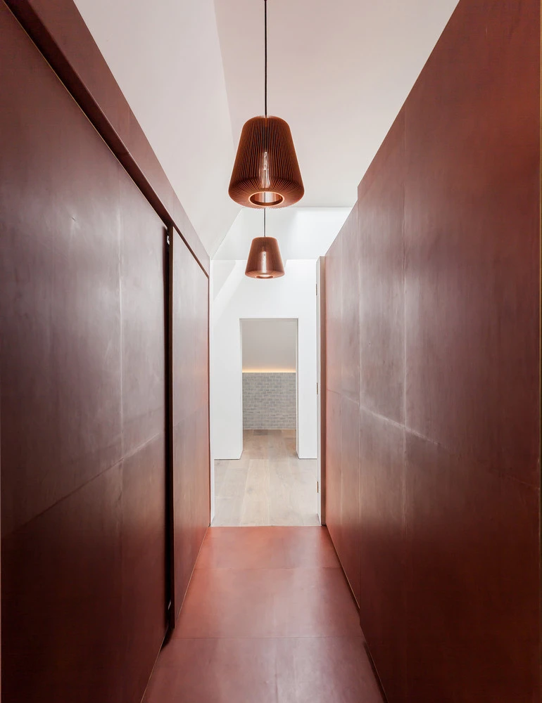 Kaleido leather tiles hiding a door (top), Freund’s leather floor tiles (middle) and Simon Astridge Architecture Workshop’s leather-clad dressing room tunnel (bottom). Photos: Nicholas Worley (bottom)