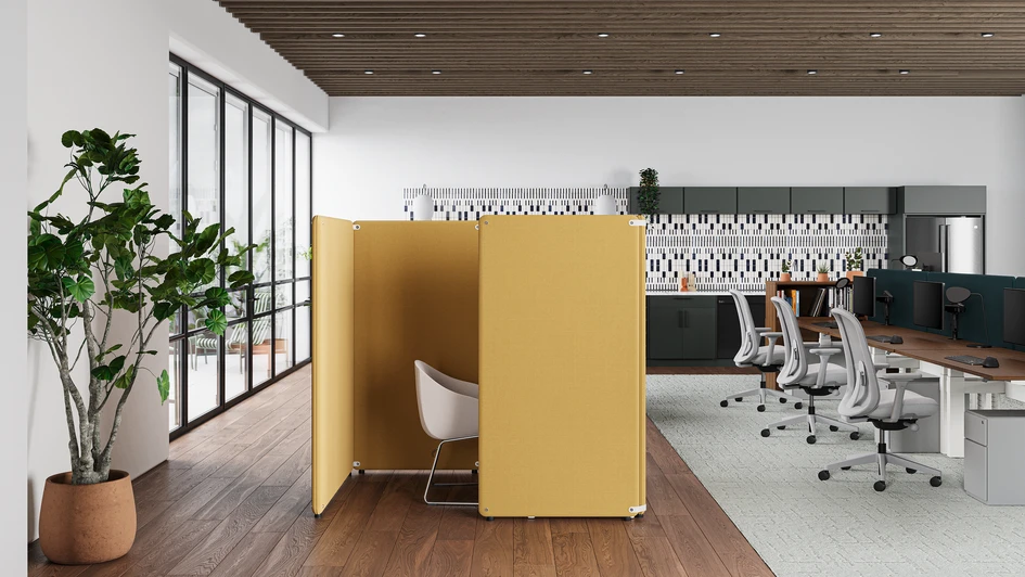 A yellow Bound freestanding screen creates a neat zone of focus in an open-plan office