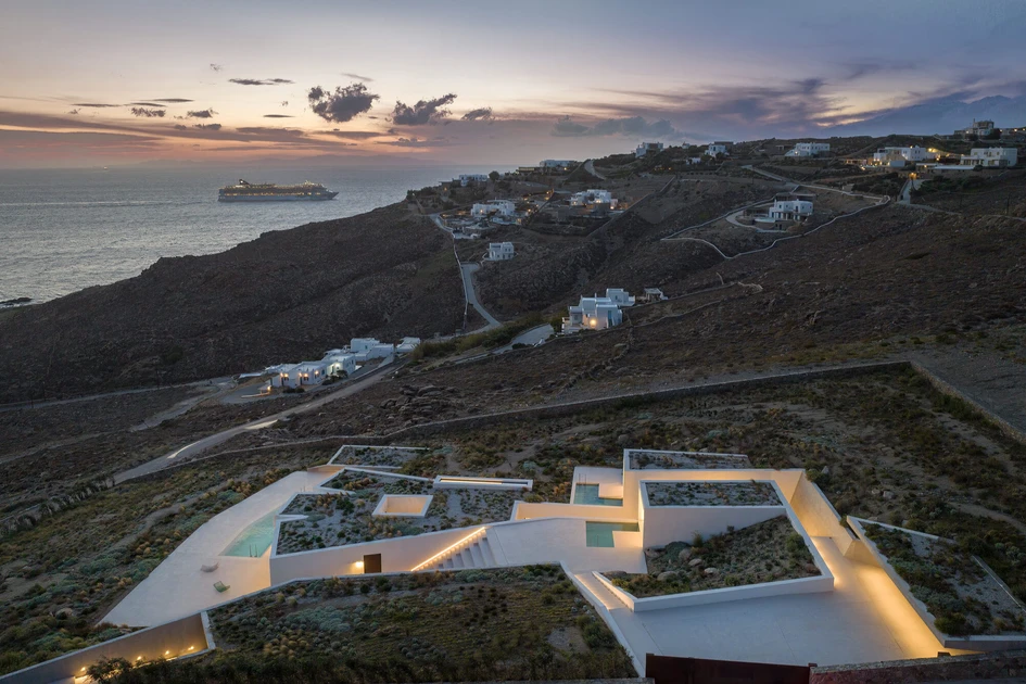 By building houses like the Latypi residence on hillsides, we can reduce the impact construction has on the landscape, while keeping the views for ourselves. Photo: Yannis Hadjiaslanis