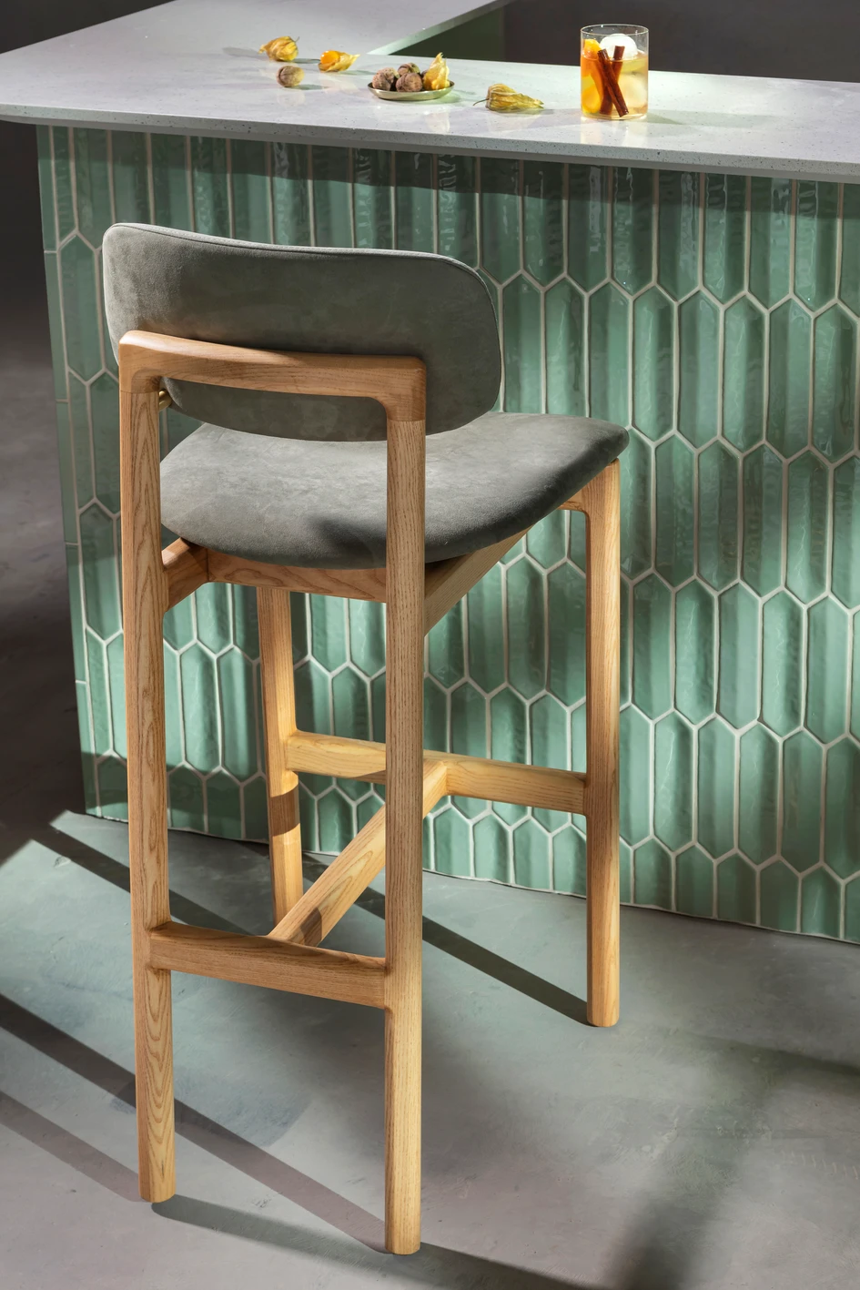 Pieces like the Nigiri bar stool combine cultural heritage and artisanal production with modern designs suited to sophisticated residential or hospitality settings