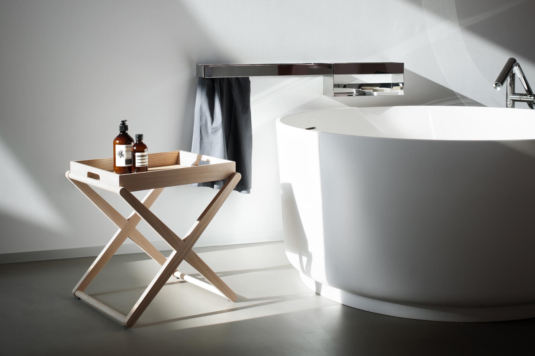 Daichi Isumi House’s bath with surrounding surface (top), House on a House’s bedside kitchenette (middle) and Agape’s bathside X table (bottom). Photos: Kenta Hasegawa (top), Christian van der Kooy (middle)