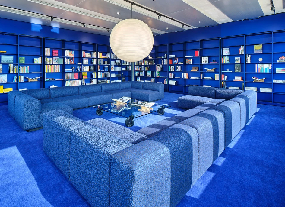 Earth-toned carpets (top), a locally-sourced rock garden (middle) and plush blue carpet (bottom) all help On running to plot a course up their mountainous office building. Photos: Mikael Olsson