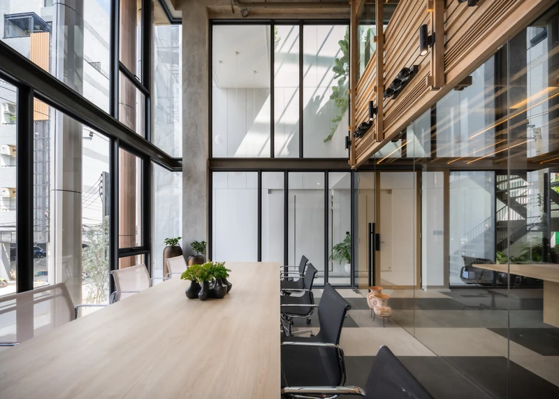 The Cardigan Office adds a double-storey structure to its high-ceiling workplace (top) while baan puripuri pull back a storey to bring in natural light. Photos: Alex Lesage (top), Beersingnoi (middle, bottom)