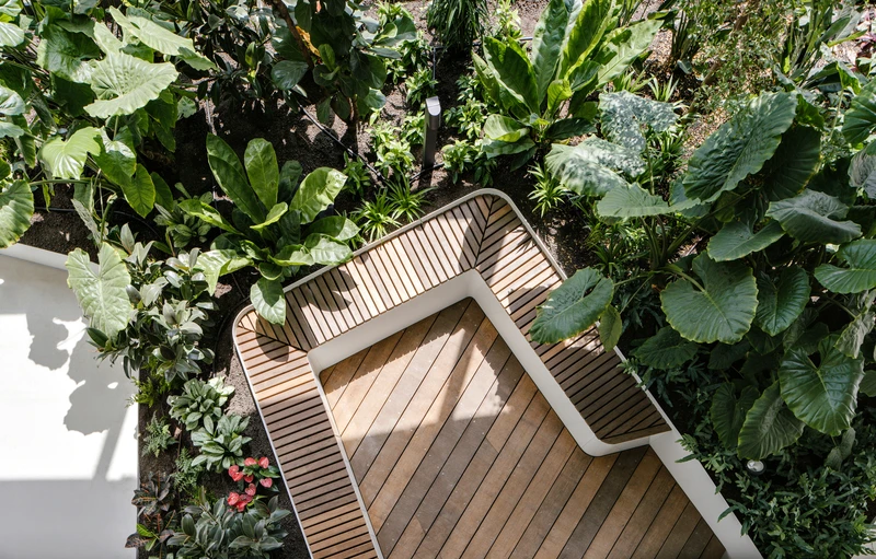The indoor park and balcony created by losing the edge of the Central Park Office Tower’s 11th and 12th floors give employees a meditative garden to roam and overlook. Photos: Sebastian van Damme
