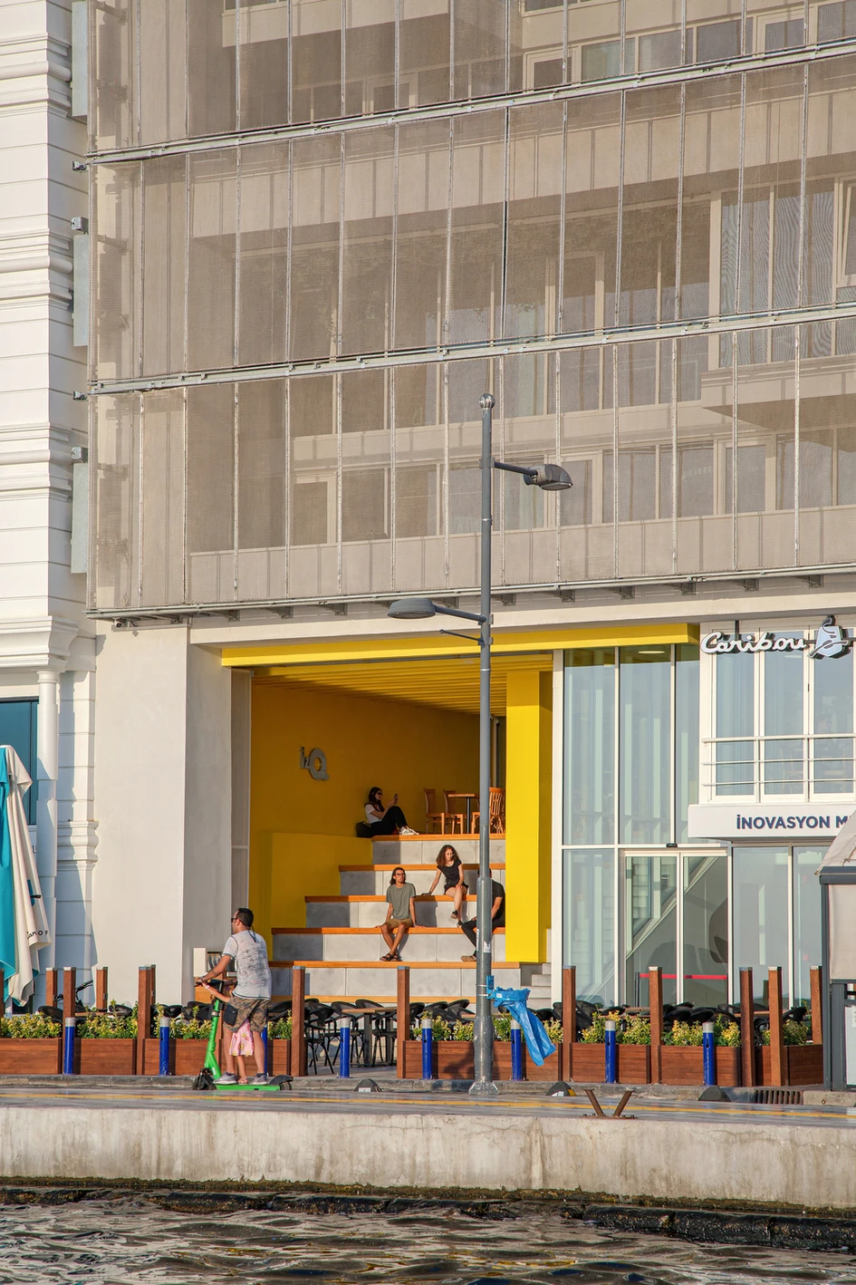 Taking advantage of its stunning location, the IzQ building opens up a kinetic facade for all to enjoy the view from its balconies, amphitheatre and front steps. Photos: Zeren Yasa & Mehmet Yasa