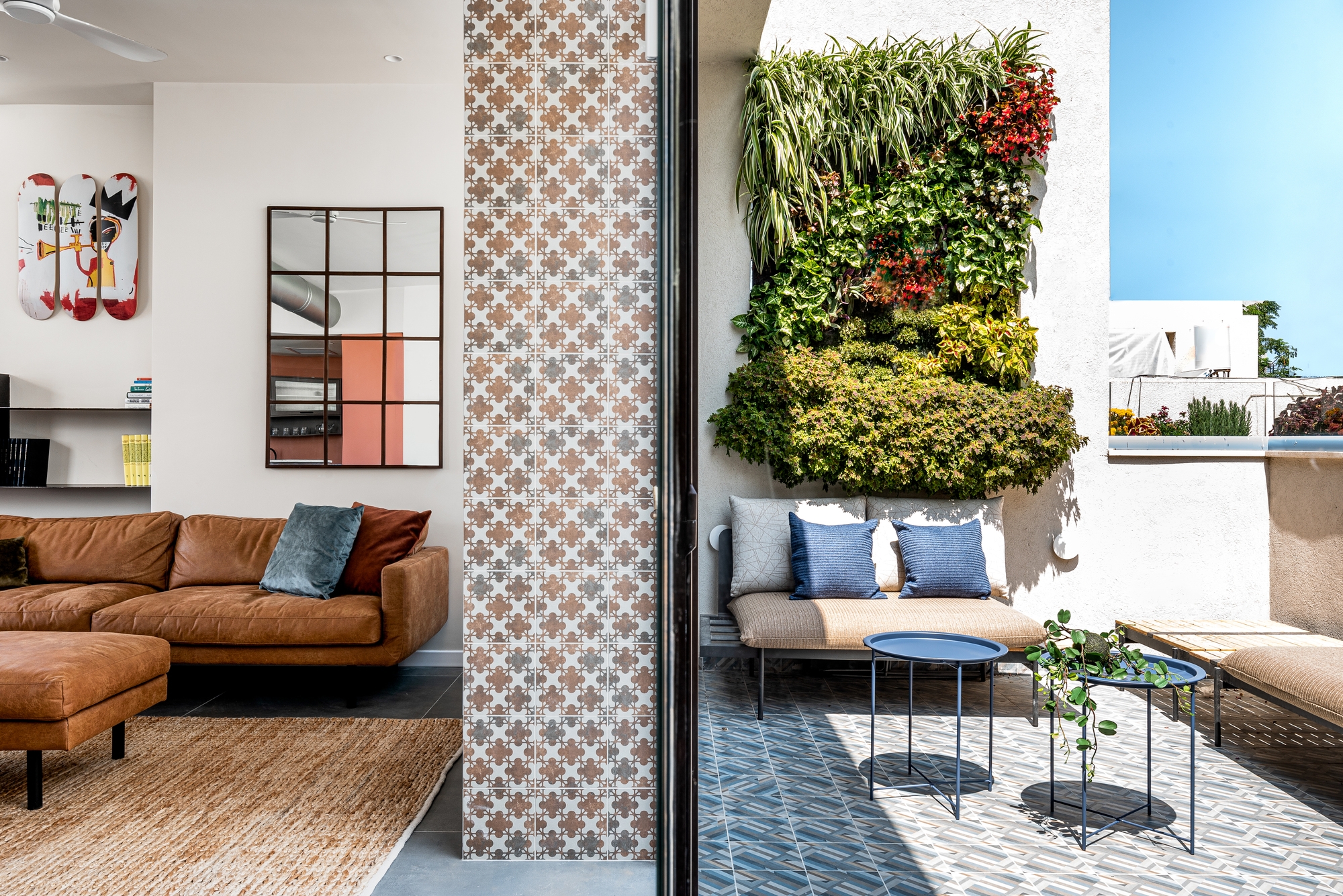 Features like living walls, slimline furniture and comfortable but hardwearing weatherproof outdoor furniture bring balconies to life, like in this apartment in Tel Aviv. Photo: Tamir Rogowski