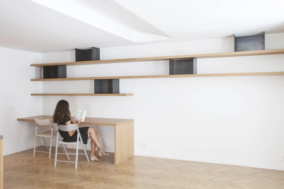 Useful shelving is littered throughout the Flat Renovation For a Photographer project by Alia Bengana, giving the owner freedom to change the decor with ease. Photo: V.Vincenzo